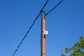 CCTV camera on a pole against the blue sky. Territory security, facility safety Royalty Free Stock Photo