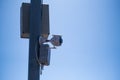 CCTV camera on pole with blue sky background, security concept Royalty Free Stock Photo