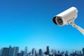 CCTV Camera security operating with buildings blur background Royalty Free Stock Photo