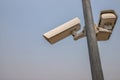 CCTV camera in security system in urban city with sky background in security concept Royalty Free Stock Photo