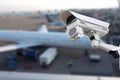 CCTV camera or surveillance operating in air port. Royalty Free Stock Photo