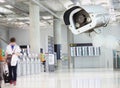 CCTV camera or surveillance operating in air port. Royalty Free Stock Photo