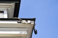 CCTV cameras on the corner of the facade of a multi-storey building