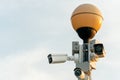 CCTV cameras in a protective white case on a lamppost. Outdoor video surveillance camera installed on the streets of the city for