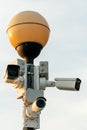 CCTV cameras in a protective white case on a lamppost. Outdoor video surveillance camera installed on the streets of the city for