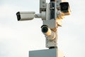 CCTV cameras in a protective white case on a lamppost. Outdoor video surveillance camera installed on the streets of the city for