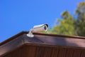 Cctv security camera with building on blue sky background Royalty Free Stock Photo