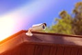 Cctv security camera with building on blue sky background Royalty Free Stock Photo