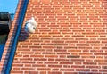 CCTV security camera in front of an office building in the city with copy space Royalty Free Stock Photo