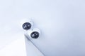 CCTV security camera installed on the white ceiling Royalty Free Stock Photo