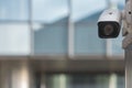 CCTV security camera on modern building wall in city Royalty Free Stock Photo