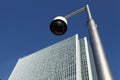 CCTV security camera near skyscraper building Royalty Free Stock Photo