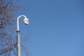 CCTV security camera outdoors, taken with a blue sky background Royalty Free Stock Photo