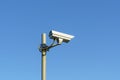 CCTV camera on pole on clear blue sky background for law and order Royalty Free Stock Photo