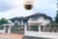CCTV Security camera and private house blurred on the background Royalty Free Stock Photo