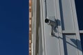 CCTV security camera on the wall outside. Royalty Free Stock Photo