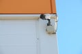 CCTV security camera on the wall outside. Royalty Free Stock Photo