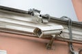 CCTV security camera on the wall outside. Royalty Free Stock Photo