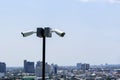 CCTV surveillance security camera on a black pole with blue sky background Royalty Free Stock Photo