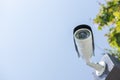 CCTV surveillance security camera on a black pole with blue sky background Royalty Free Stock Photo