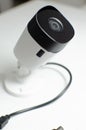 CCTV videocam, CFTV security camera, white camera with secure circuit, theft protection surveillance