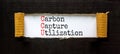 CCU Carbon capture utilization symbol. Concept words CCU Carbon capture utilization on beautiful paper. Beautiful black background Royalty Free Stock Photo