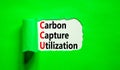 CCU Carbon capture utilization symbol. Concept words CCU Carbon capture utilization on beautiful paper. Beautiful green background