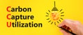 CCU Carbon capture utilization symbol. Concept words CCU Carbon capture utilization on beautiful paper. Beautiful yellow