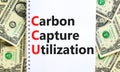 CCU Carbon capture utilization symbol. Concept words CCU Carbon capture utilization on beautiful note. Beautiful dollar background Royalty Free Stock Photo