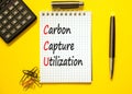 CCU Carbon capture utilization symbol. Concept words CCU Carbon capture utilization on beautiful note. Beautiful yellow background