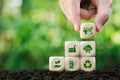 CCUS, Carbon Capture, Utilization and Storage concept.Hand holding wood block with CCUS word and icon.Technology of CO2 capturing