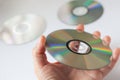 Cd compact disc in the hand on white background Royalty Free Stock Photo
