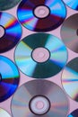 CD DVD compact disc disk dispersion refraction reflection of light colors texture on pink background Royalty Free Stock Photo