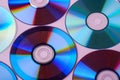 CD DVD compact disc disk dispersion refraction reflection of light colors texture on pink background