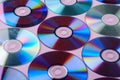 CD DVD compact disc disk dispersion refraction reflection of light colors texture on pink background