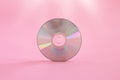 CD and DVD compact disc on pink background. Royalty Free Stock Photo
