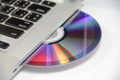 Cd or dvd disk in laptop Royalty Free Stock Photo