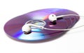 Cd , dvd disks with headphones isolated Royalty Free Stock Photo