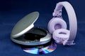 CD and CD Player and Headphones on a Blue Background Royalty Free Stock Photo