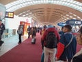 Passengers lining up for airplane boarding in the departure terminal