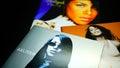 CDs and artwork of the American singer, actress, and model Aaliyah