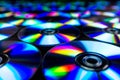 CDs / DVDs lying on a black background with reflections of light. Royalty Free Stock Photo