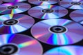 CDs / DVDs lying on a black background with reflections of light. Royalty Free Stock Photo