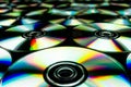 CDs / DVDs lying on a black background with reflections of light. Royalty Free Stock Photo