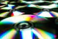 CDs / DVDs lying on a black background with reflections of light. Royalty Free Stock Photo