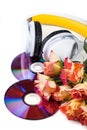 CDs, headphones and roses over white Royalty Free Stock Photo