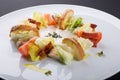 Ceasar salad with bacon served on a white plate Royalty Free Stock Photo