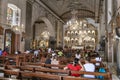 Devout Filipino worshipers of all ages, gather for worship,inside the iconic Basilica of Saint Nino,Cebu\'s oldest church