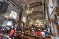 Devout Filipino worshipers of all ages, gather for worship,inside the iconic Basilica of Saint Nino,Cebu\'s oldest church