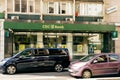 CEC bank agency branch with cars driving in front of it